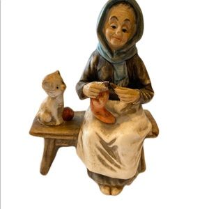 Vintage porcelain painted lady knitting with kitten figurine